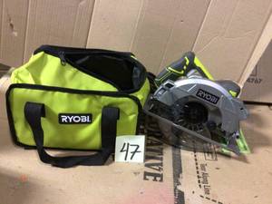 lot 47 image: 15 Amp Corded 7-14 in. Circular Saw with EXACTLINE Laser Alignment System, 24T Carbide Tipped Blade, Edge Guide and Bag by RYOBI WORKINHG CONDTION SEE PICS 