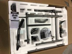 lot 112 image: 10 in. Pro Jobsite Table Saw with Stand by RIDGID in good conditions