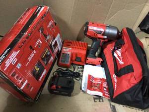 lot 77 image: M18 FUEL 18-Volt Lithium-Ion Brushless Cordless 12 in. Impact Wrench wFriction Ring Kit wOne 5.0 Ah Battery and Bag by Milwaukee in good conditions 