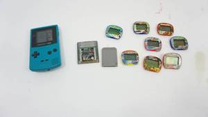 Working Nintendo Game Boy Color Hand Held Game with 2 Cartridges  8 Micro Game Cartridges