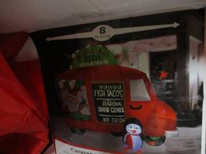 lot 111 image: 8 ft Long Caravan with Santa Inflat...