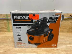 lot 34 image: RIDGID 4 Gal. 5.0-Peak HP Portable WetDry Shop Vacuum with Filter, Hose and Accessories