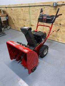 lot 1 image: TROY-BILT 24 in. 208 cc Two-Stage Gas Snow Blower with Electric Start Self Propelled