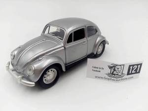 lot 121 image: Volkswagen Bug Paperclip Magnet and Dapper Dashboard Man