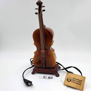 lot 190 image: Amber Art Glass Violin Lamp - Valued  $100