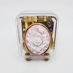 lot 345 image: Glass Globe Paperweight and Music Box Mechanism, Brand New