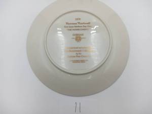 lot 011 image: Norman Rockwell - First Issue Mothers Day Plate-The Homecoming (Valued  $35)