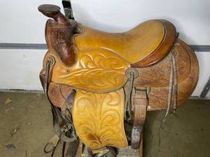 lot 11 image: Vintage Hand-Tooled Leather Saddle (Valued $1500)