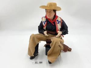 Porcelain Seated Cowboy Figurine