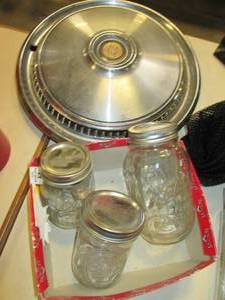 lot 83 image: Cordoba Hubcaps & Canning Jars With...
