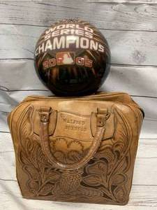 lot 15 image: Undrilled World Series Bowling Ball, Leather Bag, Shoes Size 7 12