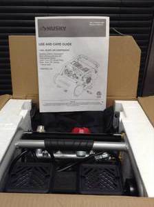 lot 18 image: 1 Gal. Portable Electric-Powered Silent Air Compressor by Husky- open box not used