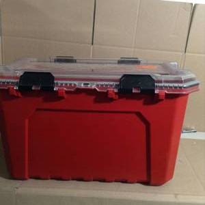 lot 49 image: 20-Gal. Professional Duty Waterproof Storage Container with Hinged Lid in Red by Husky- not used