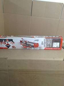 lot 92 image: 26 in. Star Max Tile Cutter by Rubi- open box not used