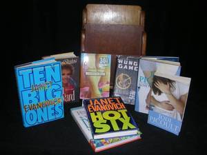 lot 33 image: WOODEN MAGAZINE RACK WITH CURRENT HARDCOVER BOOKS.