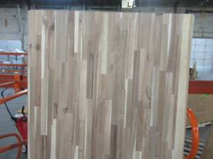 lot 606 image: Interbuild 6 ft. L x 2 ft. 1.5 in. D x 2 in. T Butcher Block Countertop in Unfinished Acacia with Live Edge PNL03106