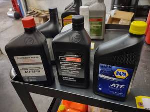 lot 98 image: (5) Quarts Assorted ATF...