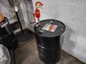 lot 104 image: 55 Gallon Drum with Approx. 7 of F...