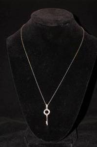 lot 130 image: Sterling Silver Key Pendant with Chain