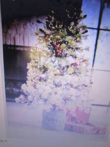 lot 75 image: 4-Ft. Prelit Tree with Trunk Pot op...