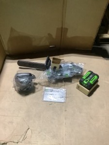 lot 33 image: EGO 14 IN . 56-VOLT LITHIUM-ION CORDLESS CHAINSAW WITH 2Ah BATTERY AND CHARGER. NOT USED
