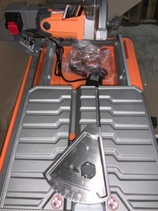 lot 68 image: RIDGID 9 Amp Corded 7 in. Wet Tile Saw with Stand OPEN BOX TESTED