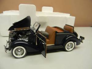 lot 40 image: THE DANBURY MINT 1936 FORD DELUXE CABRIOLET - 124 SCALE - NEW IN BOX EXCELLENT CONDITION - GREAT PIECE - SEE PICTURES