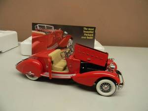 lot 45 image: THE DANBURY MINT 1934 PACKARD V-12 LEBARON SPEEDSTER - 124 SCALE - NEW IN BOX EXCELLENT CONDITION - GREAT PIECE - SEE PICTURES