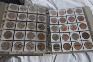 lot 51 image: Album Full of Wooden Nickels - Over 100
