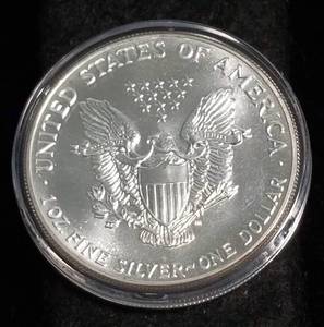 lot 10 image: 1987 AMERICAN SILVER EAGLE 1 TROY OZ. .999 FINE SILVER IN AIRTITE