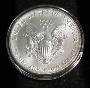 lot 39 image: 1991 AMERICAN SILVER EAGLE 1 TROY OZ. .999 FINE SILVER IN AIRTITE