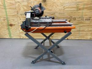 lot 76 image: RIDGID 9 Amp Corded 7 in. Wet Tile Saw with Stand