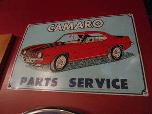 lot 222 image: Car Signs & Hubcap