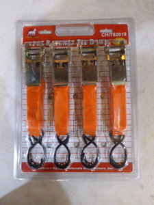 lot 35 image: White Dog 4 Piece Ratchet Tie-Downs