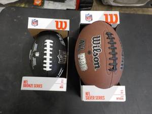 lot 77 image: New Wilson Football x2...