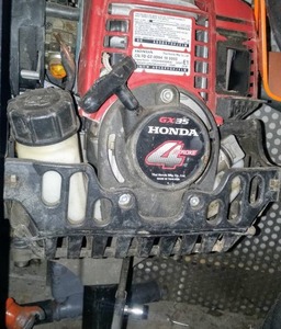 lot 23 image: Honda gas Powered Titan Post Driver