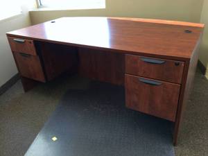 lot 1 image: WOW MSRP $1200 High Quality Bourbon Cherry Laminate Extended Bow Front Locking Double Pedestal Executive Office Desk - Like New Condition With Exception Of Small Mark On Front Of Drawer & No Keys 