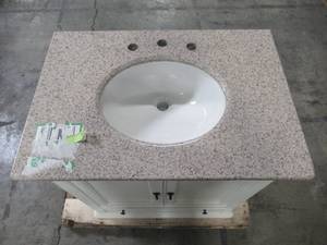 lot 115 image: Home Decorators Collection Newport 31 in. W x 21.50 in. D Bath Vanity in Ivory with Granite Vanity Top in Champagne with White Basin 9085-VS31L-DW
