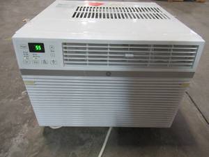 lot 320 image: GE 12,100 BTU 115-Volt Smart Window Air Conditioner. AEC12AY - UNIT ONLY, MISSING MOUNT HARDWARE, REMOTE, LOUVERS - WORKS WELL.