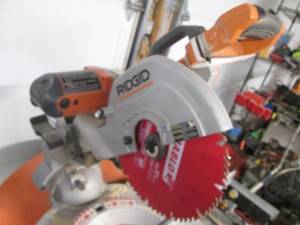 lot 51 image: Ridgid 12 Table Saw on Ridgid Cart...