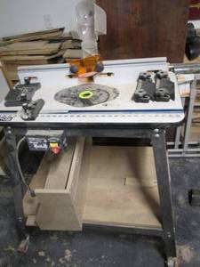 lot 61 image: Ryobi Routing Table Stand On Wheels...