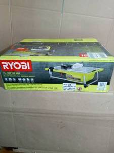 lot 46 image: 0.75 HP 7 in. 4.8 Amp Tabletop Tile Saw by RYOBI- open box not used