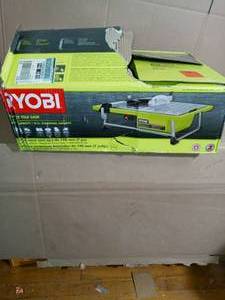lot 53 image: 0.75 HP 7 in. 4.8 Amp Tabletop Tile Saw by RYOBI- used missing parts