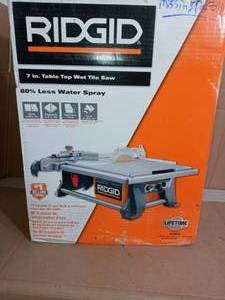 lot 79 image: 6.5 Amp Corded 7 in. Table Top Wet Tile Saw by RIDGID- missing parts