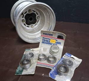 lot 169 image: TRAILER BEARING KITS AND A SMALL RIM