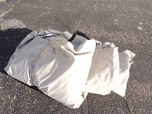 lot 13 image: Gray Tarp Good for Woodpile