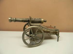 lot 50 image: VINTAGE METAL CANNON MUSIC BOX - METAL, GENUINE LEATHER, IMPOSSIBLE DREAM STASH MUSIC BOX - VERY COOL PIECE - SEE PICTURES
