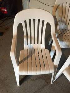 4 White Plastic Stacking Chairs