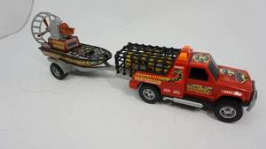 lot 31 image: Vintage Buddy L Anaconda Attacker Toy Truck & Air Boat with Trailer