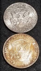 lot 34 image: GROUP OF 2 1964 KENNEDY SILVER HALF DOLLARS DARK UGLY TONING